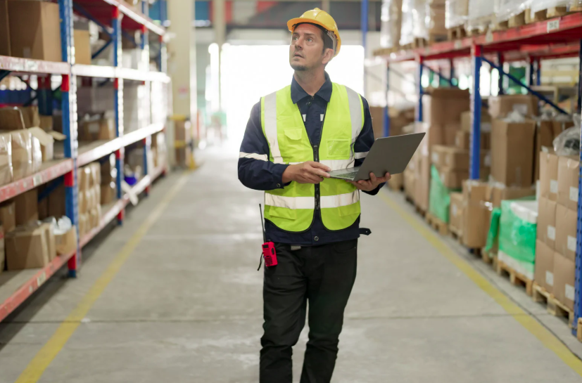 Warehouse specialist conducting a walkthrough and facility assessment